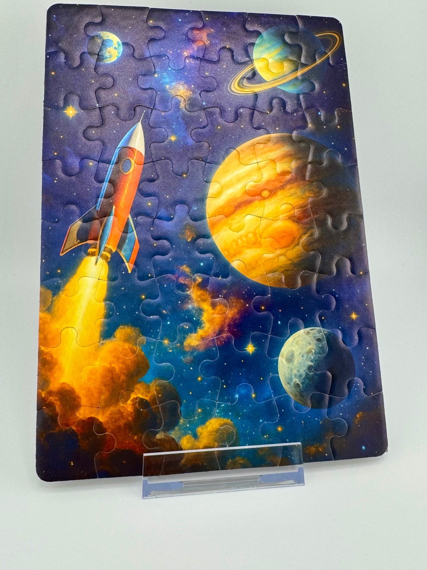 Space-themed puzzle with planets and a rocket on a white background